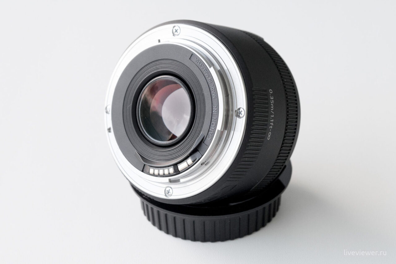 Canon 50mm 1.8 STM lens side view, contacts